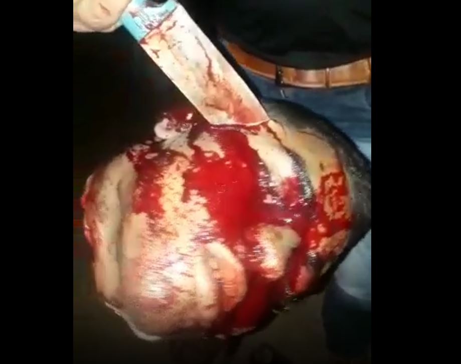 Gang beheading video – beheading and destroying the severed head of a rival gang member