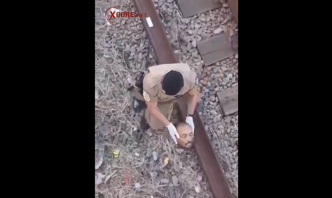 Horrific Scene Captured on Video: Police Officer Recovers Severed Head from Train Tracks in Brazil