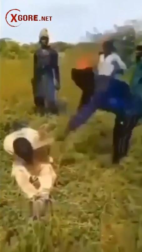 Boko Haram member recorded beheading a man with a machete