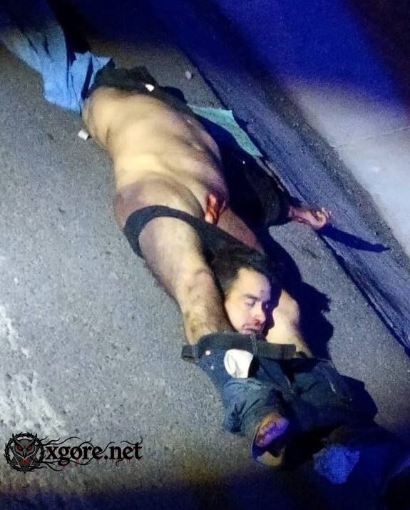 decapitated body - Cartel Threat Message Leaves Head Between Legs