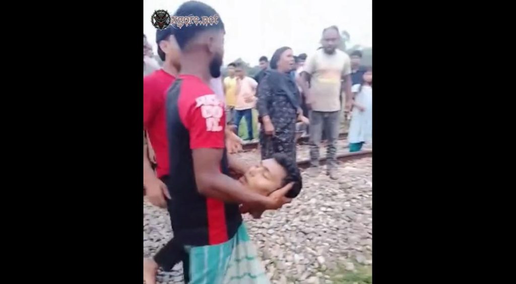 They are clearing away the corpse of a man who was beheaded by a train