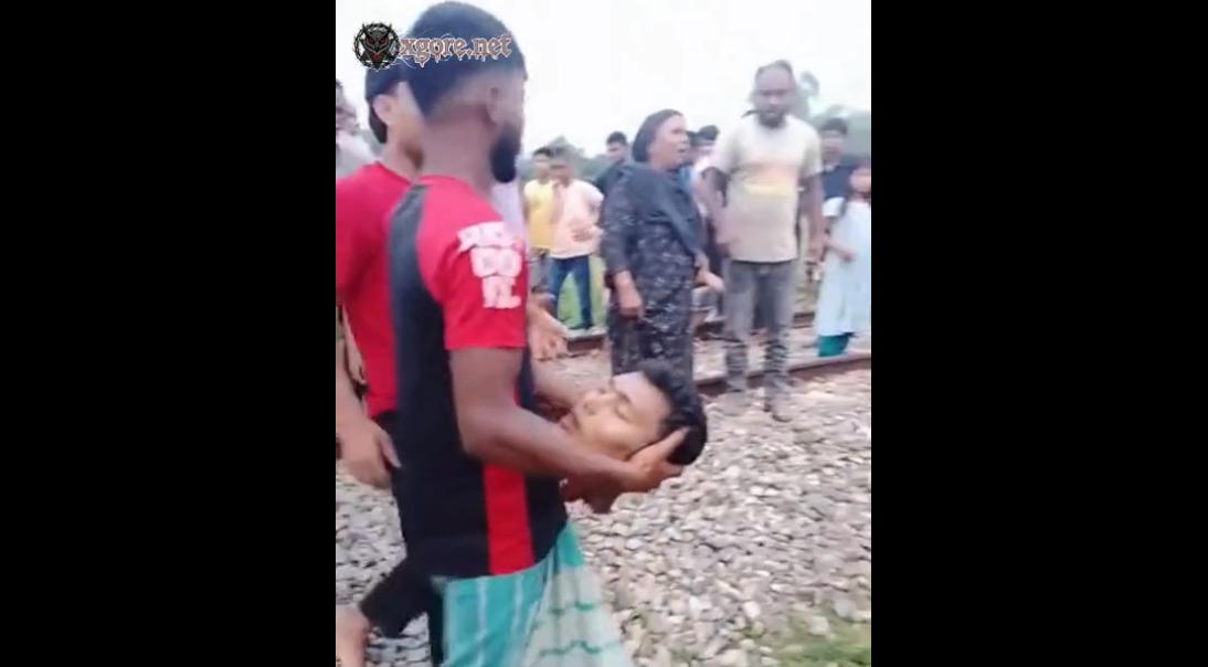 They are clearing away the corpse of a man who was beheaded by a train