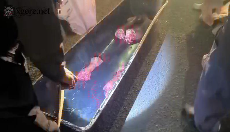 The dismembered body of a man is being arranged