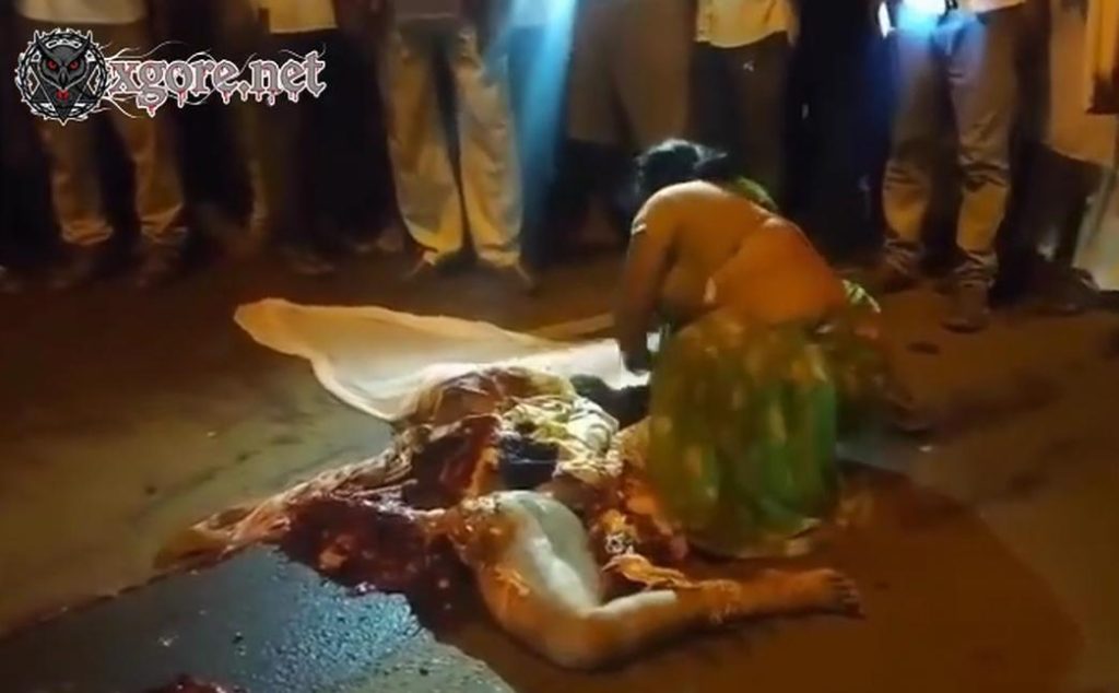 A woman wailed beside a body crushed by a truck